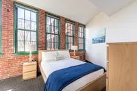 Your comfortable bedroom offers welcoming space with room for furniture, storage, and personal touches.  | Watch Factory Lofts | Watch Factory Lofts Apartments