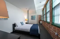 The airy bedroom provides bright, open atmosphere with natural light and comfortable proportions throughout.  | Watch Factory Lofts | Waltham Apartments