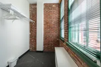 Large closet area with natural light Watch Factory Lofts apartments in Waltham, MA.| Watch Factory Lofts | Watch Factory Lofts Apartments