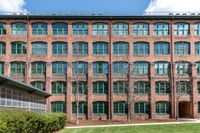 Exterior with brick and windows at Watch Factory Lofts apartments in Waltham . | Watch Factory Lofts | Watch Factory Lofts Apartments