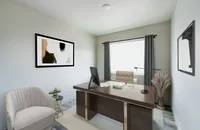Sleek home office with modern desk, comfortable chair, and contemporary art on walls.