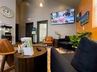 Welcoming lounge area with stylish seating, modern decor, and vibrant accents.
