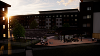 Charming apartment complex courtyard at sunset with inviting seating and greenery.