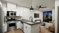 Contemporary kitchen with sleek appliances and open living area with a large window view.
