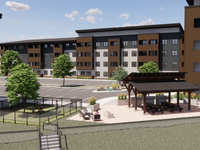 A modern apartment complex with a recreational area, green landscaping, and inviting outdoor seating.