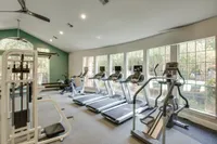 View of Fitness Center with Ceiling Fan,and Cardio Machines, at Raveneaux Apartments
