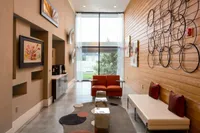 View of Resident Lounge, Showing WiFi Café, Seating Areas, and Window View at Cottonwood Westside Apartments