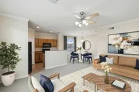 Enclave on Golden Triangle Open Concept Floor Plan with a view of the Kitchen, Dining Table Area, and Living Room