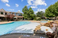 View of Enclave on Golden Triangle Apartments Pool and Waterfall