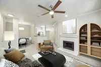 View of Renovated Apartment Living Area, Dining, Room and Kitchen with Stainless Steel Appliances