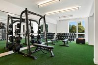 Elevate your workouts in this bright and fully equipped fitness center at 805 Riverfront in Sacramento with City View