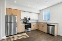 Experience the elegance of this sleek kitchen, perfect for culinary adventures at 805 Riverfront in Sacramento
