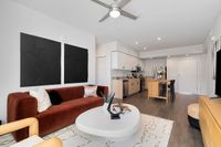 Step into this contemporary apartment combining elegance and functionality with a welcoming open-concept living area.