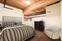 The Mill Loft Bedroom at Alpha Mill Apartments