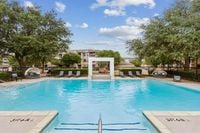 Resort-Style Pool Luxurious pool at Toscana Valley Ridge area with inviting sun loungers and lush greenery, perfect for relaxation and leisure in Lewisville Texas