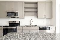 Sleek Granite Countertops and Stainless Steel Appliances
