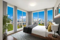Sugarmont Townhome Bedroom View of Sugarmont's Two Bedroom Townhome Showing Floor-to-Ceiling Windows, Modern Med and Rug, Nightstand, Mirrors, Curtains, and Mountain Views