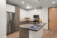 Sugarmont Kitchen Modern kitchen at Sugarmont Apartments and Townhomes with sleek stainless steel appliances, elegant cabinetry, and a stylish island perfect for entertaining in Salt Lake City.