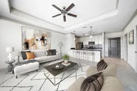 Open-Concept Floor Plans Modern open-concept living room at Heights at Meridian Apartments with elegant neutral tones, stylish furniture, and a sleek kitchen with stainless steel appliances.