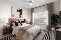 Elegant bedroom at Summer Park Apartments featuring a cozy king-size bed, modern decor, and soft natural lighting through large windows.