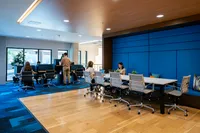 Apt CoWork Community Workspace at Sugarmont Apartments in Sugarhouse (2) Modern coworking space with sleek furnishings, vibrant blue accents, and natural light; perfect for productivity and collaboration at Apt CoWork at Sugarmont Apartments in Sugar House