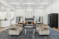 Elegant and spacious communal workspace with plush seating, modern decor, and natural light, perfect for working from home at Stonebriar at Frisco Apartments