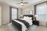 Elegant bedroom with modern design, featuring a comfortable bed, chic decor, and ample natural light through large windows at Raveneaux Apartments in Houston.