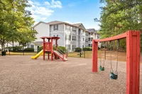 Playground at Lake St James Apartments in Conyers, GA