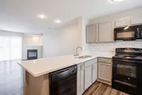 Kitchen and Living Room With Fire Place