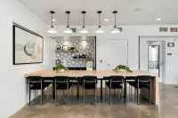 Experience the charm of this contemporary dining area, perfect for gatherings at 805 Riverfront Apartments in Sacramento