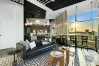 Experience luxury and style in this contemporary lounge, perfectly designed for relaxation and socializing at 805 Riverfront Apartments in Sacramento