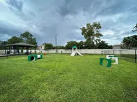 Explore the enjoyment your pet will have in this spacious, well-equipped dog park!