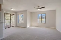Experience openness and light with a bright living room leading to a private balcony.