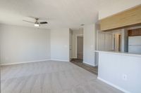 Experience contemporary comfort in this luminous living area ready to personalize.