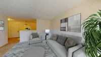 Inviting living room with modern furniture, elegant decor, and a cozy atmosphere, perfect for relaxation and entertaining.