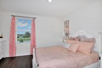 Spacious bedroom with a window at a home for rent in Apopka, Florida.