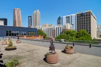 Spacious rooftop deck with skyline views