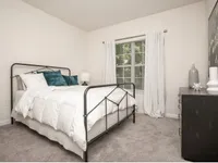 Bright, serene bedroom with cozy finishes