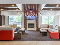 Stylish resident clubhouse with cozy lounge areas.