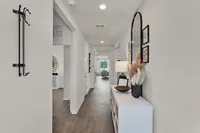 Bright and welcoming entryway with stylish modern touches.