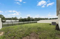 Private fenced-in backyard with room to relax or play.