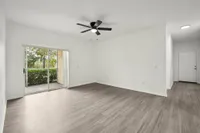 interior pic of deluxe unit living room with gray planking and white walls