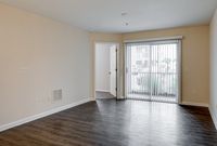 Spacious living room with private patio access.