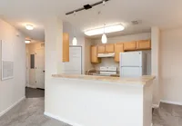 Open-concept kitchen with breakfast bar.