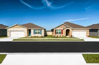 Charming single-story homes with private driveways and manicured lawns.