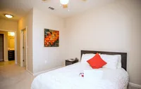 Spacious bedroom with en-suite access and ample closet space.