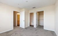 Primary bedroom with ensuite bath and walk-in closet.