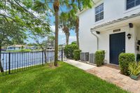 Waterfront townhomes with a lush garden, private entrance, and picturesque lake views.