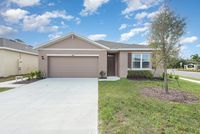 Charming single-story home with a spacious garage.