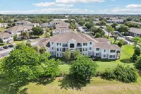 Charming apartment complex surrounded by lush greenery, featuring modern architecture and spacious layouts, ideal for serene living.